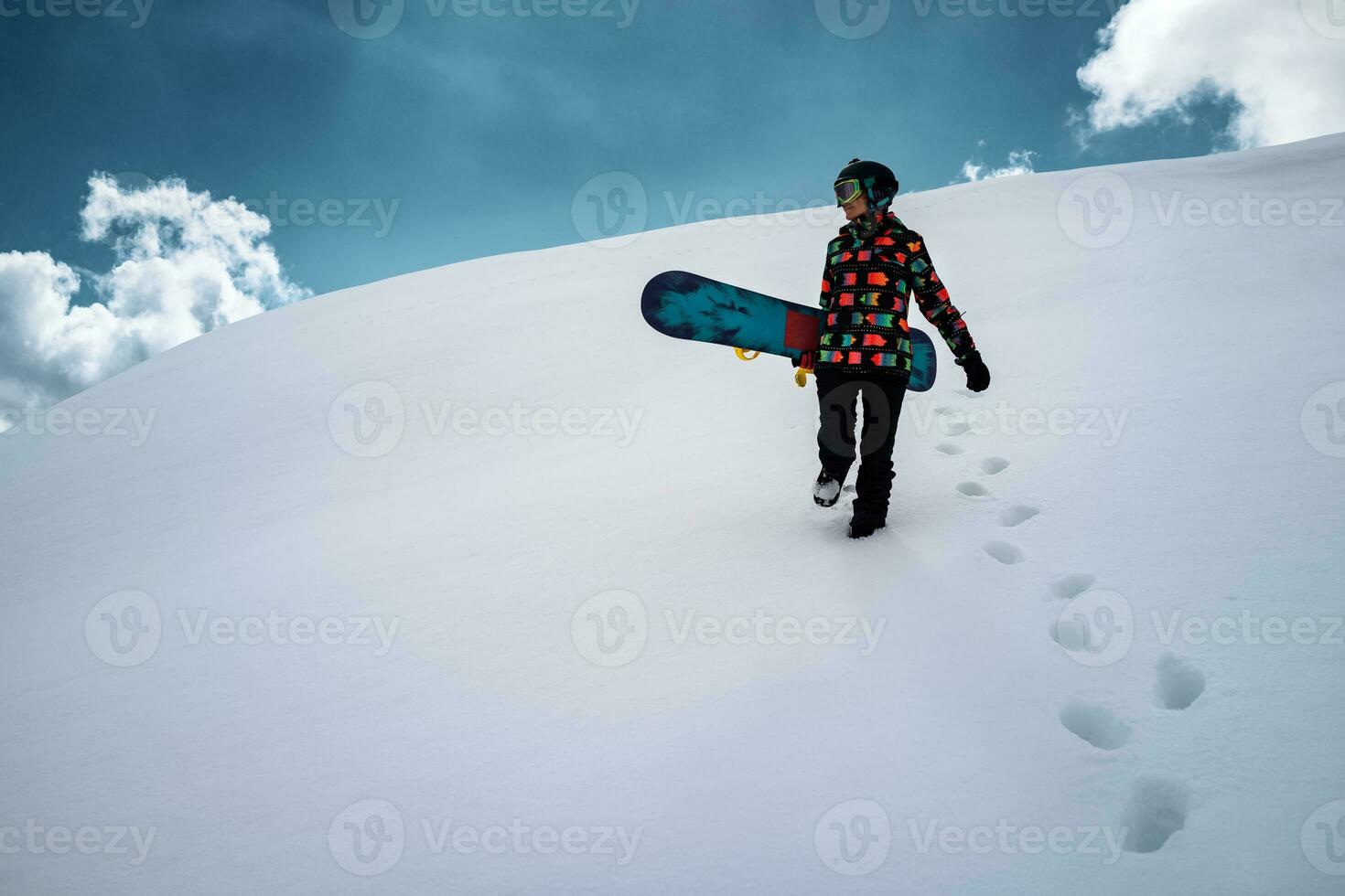 Girl snowboarder enjoys winter sport photo