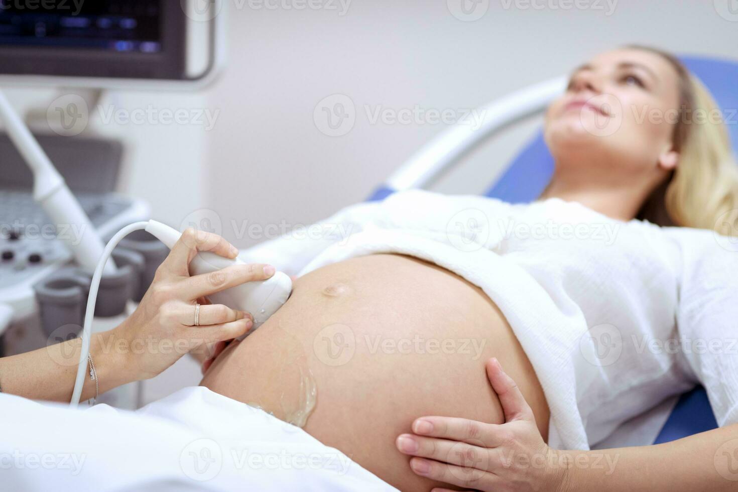 Pregnant woman on ultrasound photo