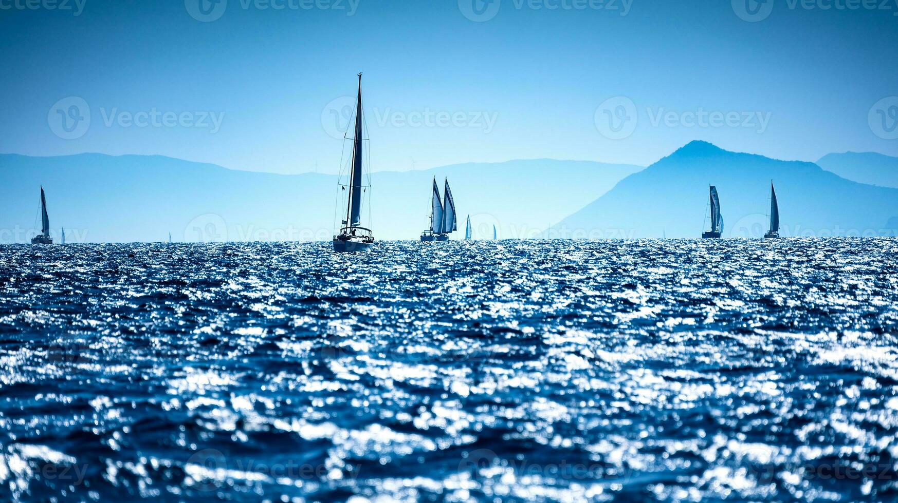 Sailboats in the sea photo