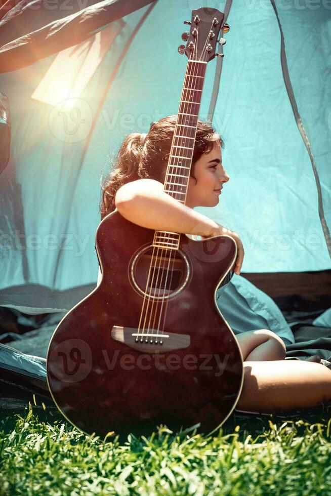 Teen girl with guitar photo