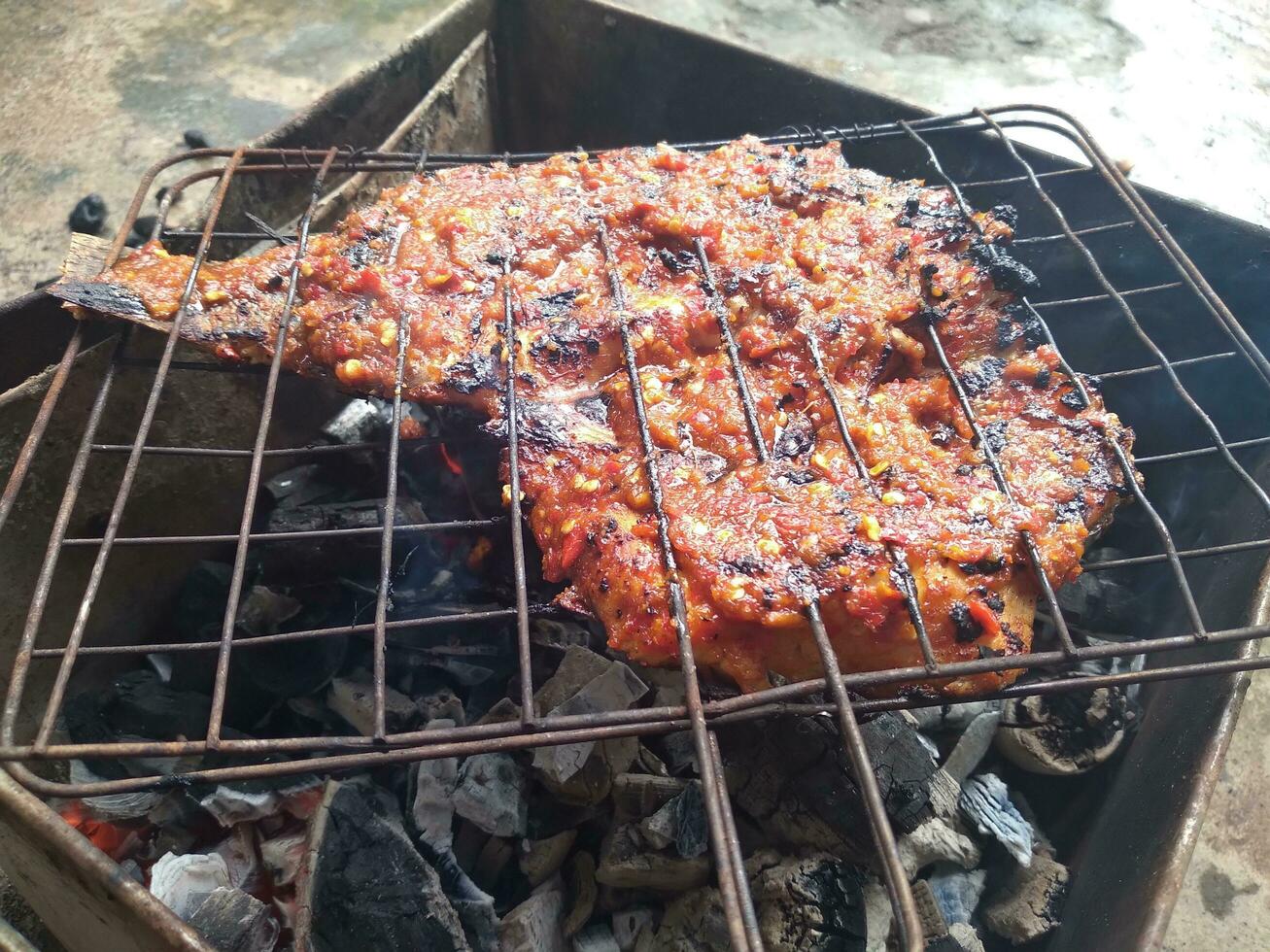 grilled tilapia with a delicious and slightly spicy taste photo