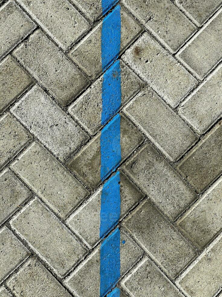 paving block texture with blue line photo
