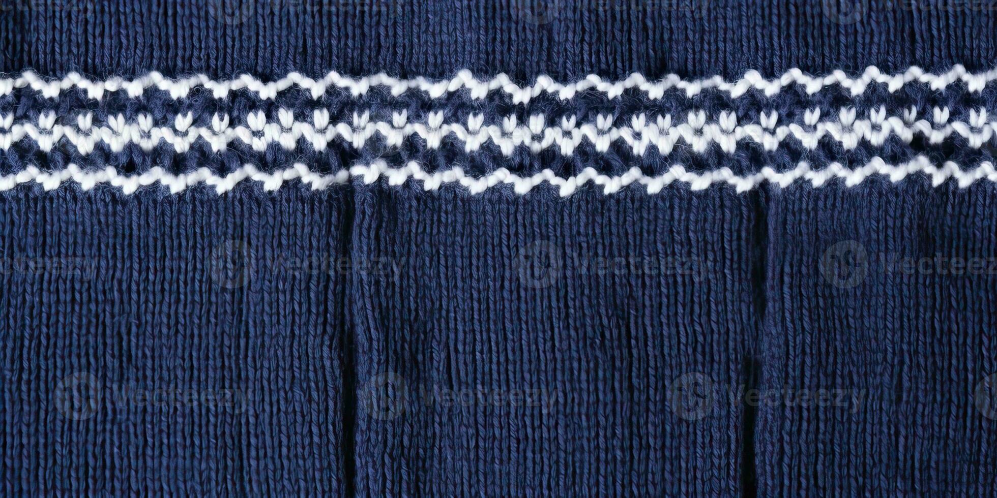 AI generated Wool sweater texture of dark blue color with white border. Natural knitted wool indigo color photo