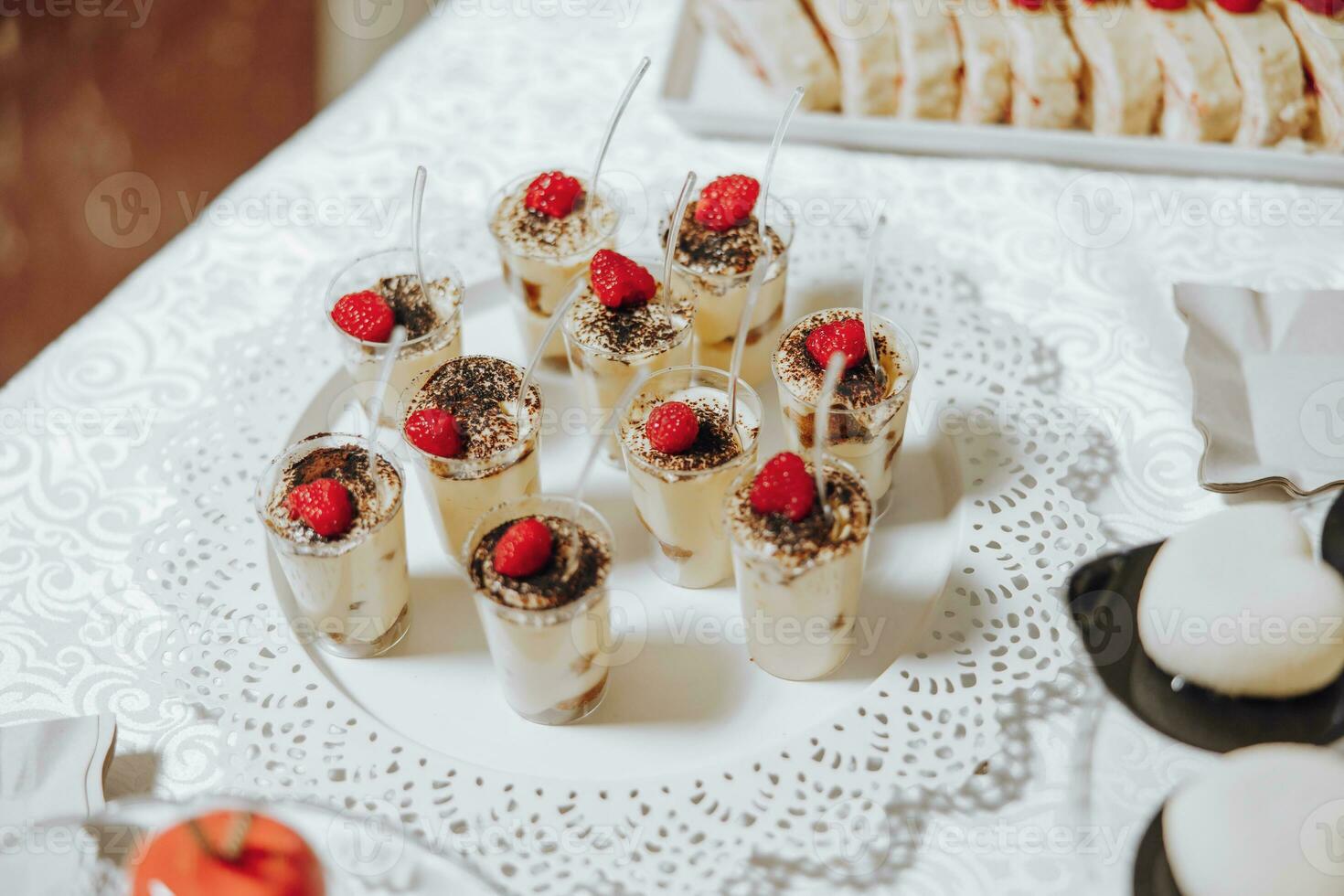 Candy bar. Table with sweets, candies, dessert. cakes and berries in the candy bar. Candy bar with delicious mini cakes, selective focus photo