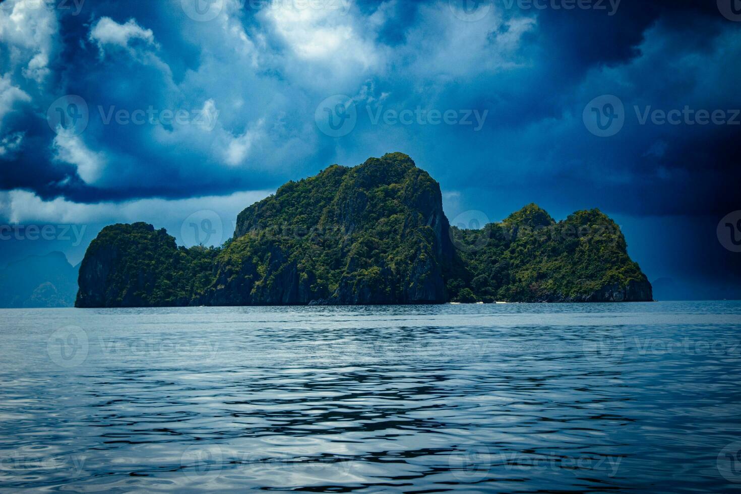 View from a traditional Filipino boat of an island in Palawan. photo