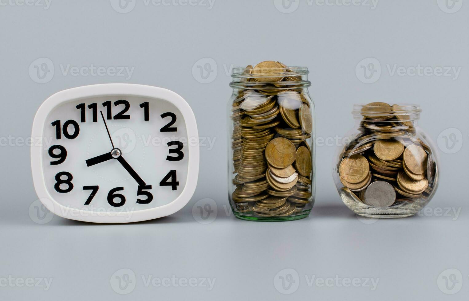 Saving money and working time of money and time Wage stream, funds, coin bank photo