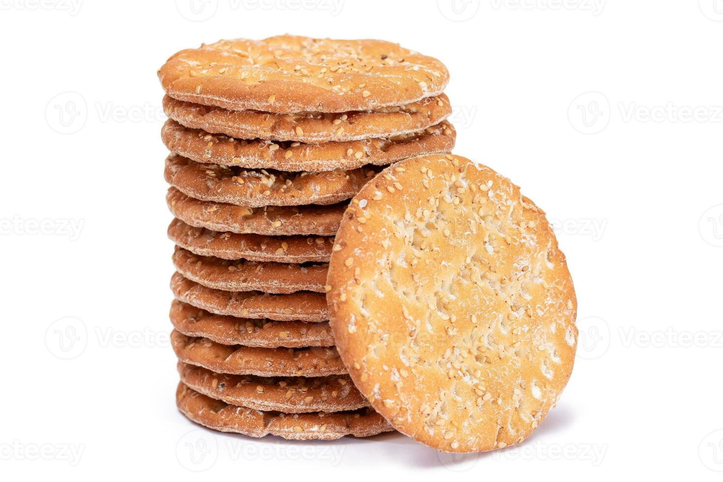 A Stack of Round Salt Crackers with Sesame Isolated on White Background. Dry Snacks - Isolation photo