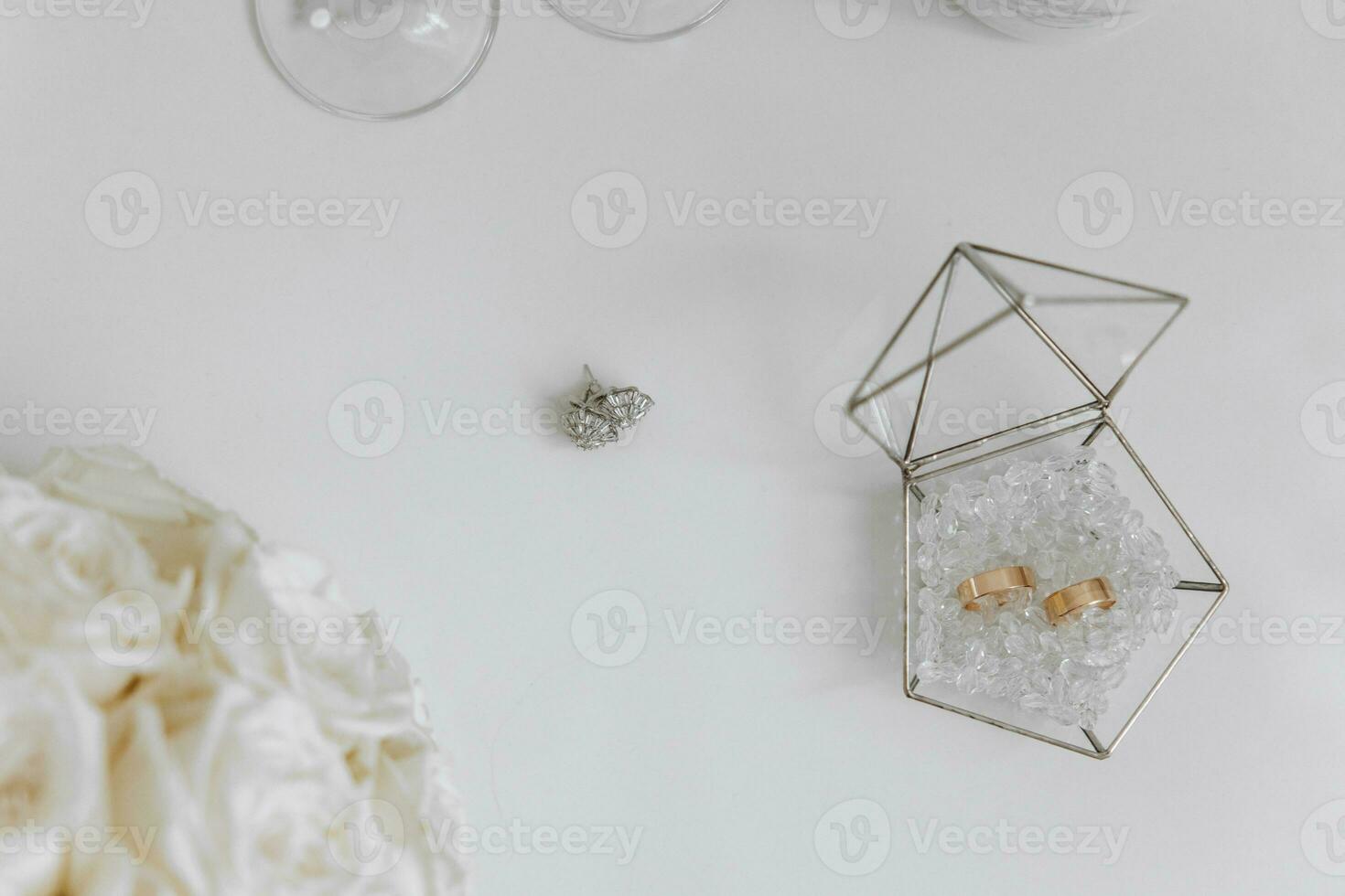 Wedding rings Background. gold wedding rings on the pincushion. the bride's wedding ring on a wedding white pillow photo