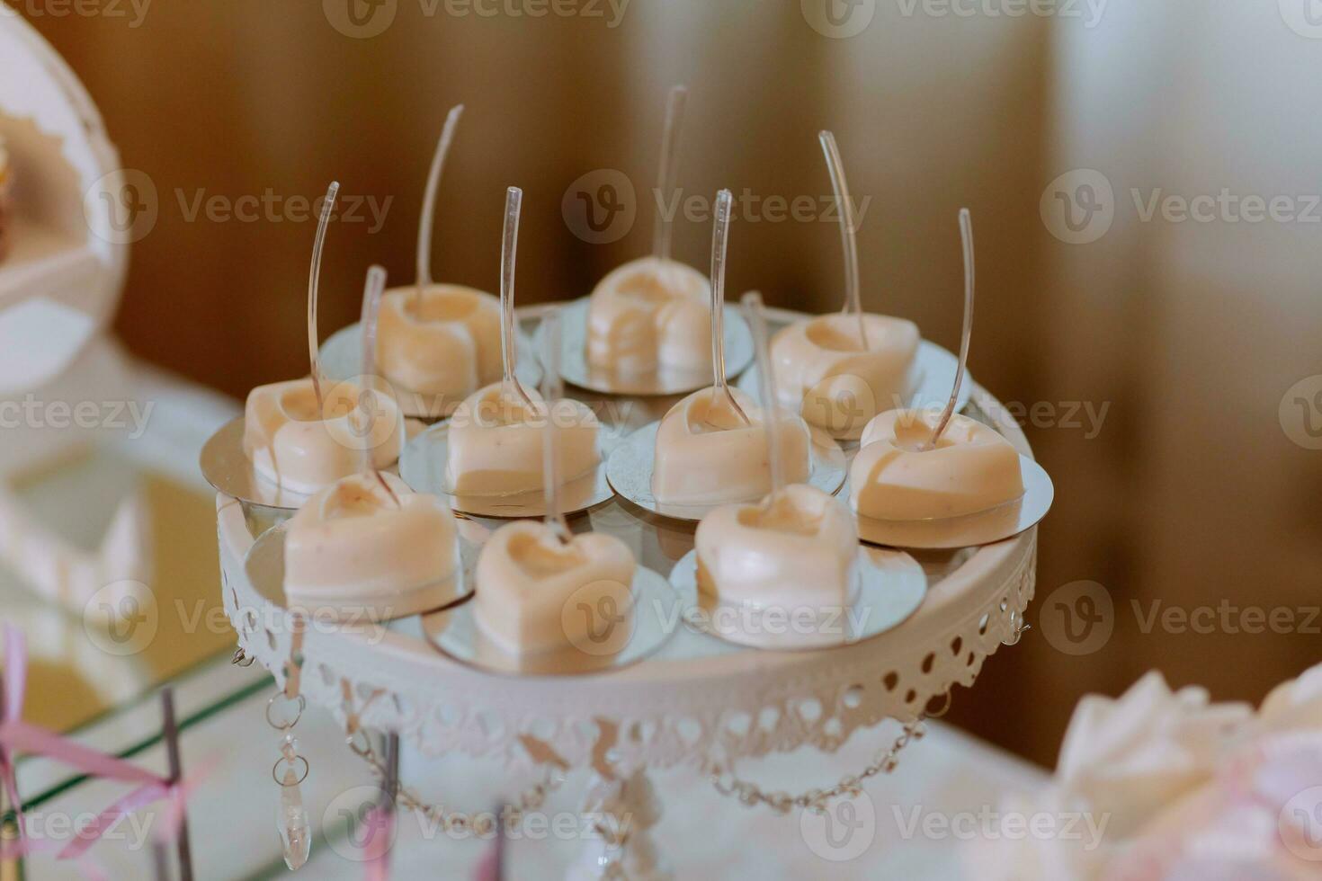 A delicious wedding. Candy bar for a banquet. Celebration concept. Fashionable desserts. Table with sweets, candies. Fruits photo