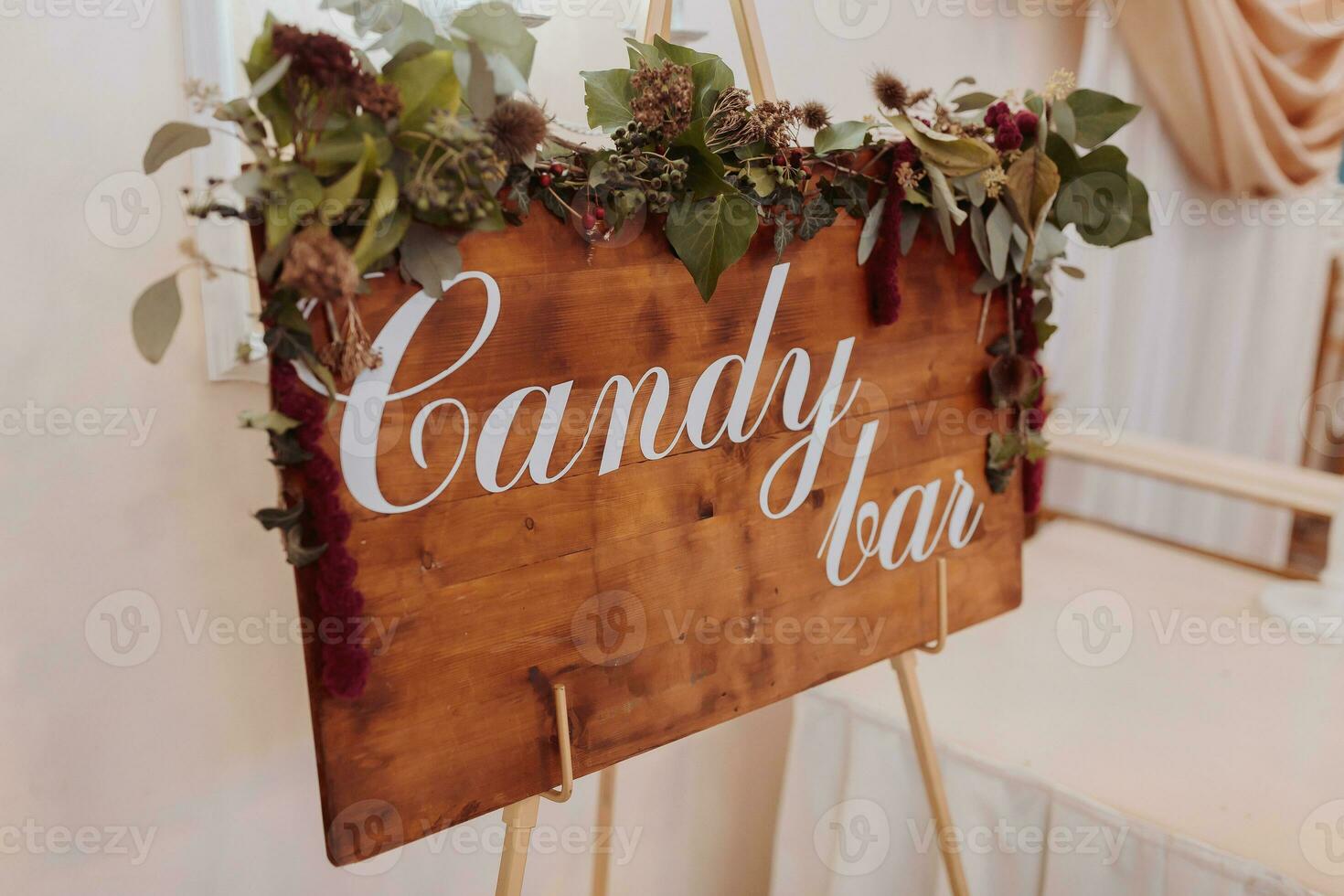 A delicious wedding. Candy bar for a banquet. Celebration concept. Fashionable desserts. Table with sweets, candies. Fruits. Blackboard with the inscription candy bar photo