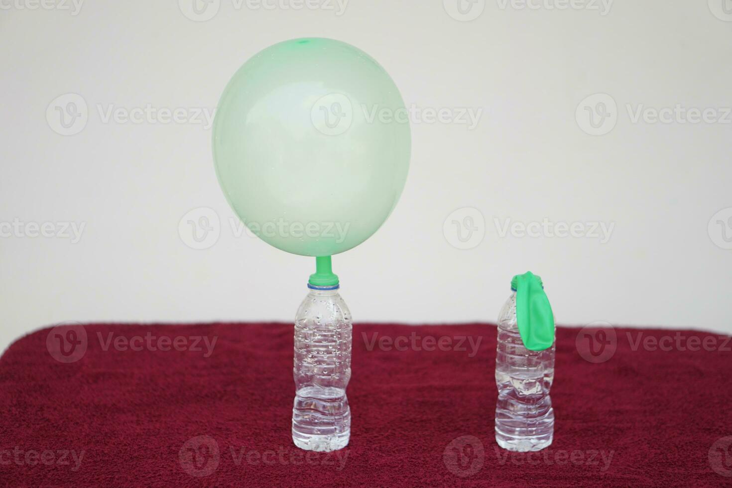 Science experiment , inflated balloons and flat balloon on top of transparent test bottles. Concept, science experiment about reaction of chemical substance. photo