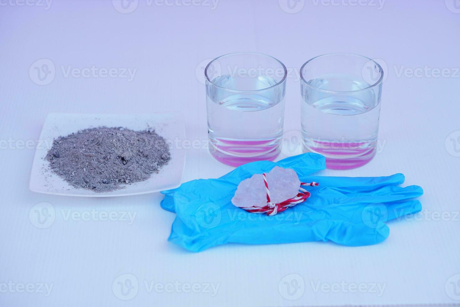 Equipment for doing science experiment about sedimentation by using alum stone with ash water in glass.Concept, Education, Easy activity lesson for kids. Reaction of chemical substance in alum stone. photo