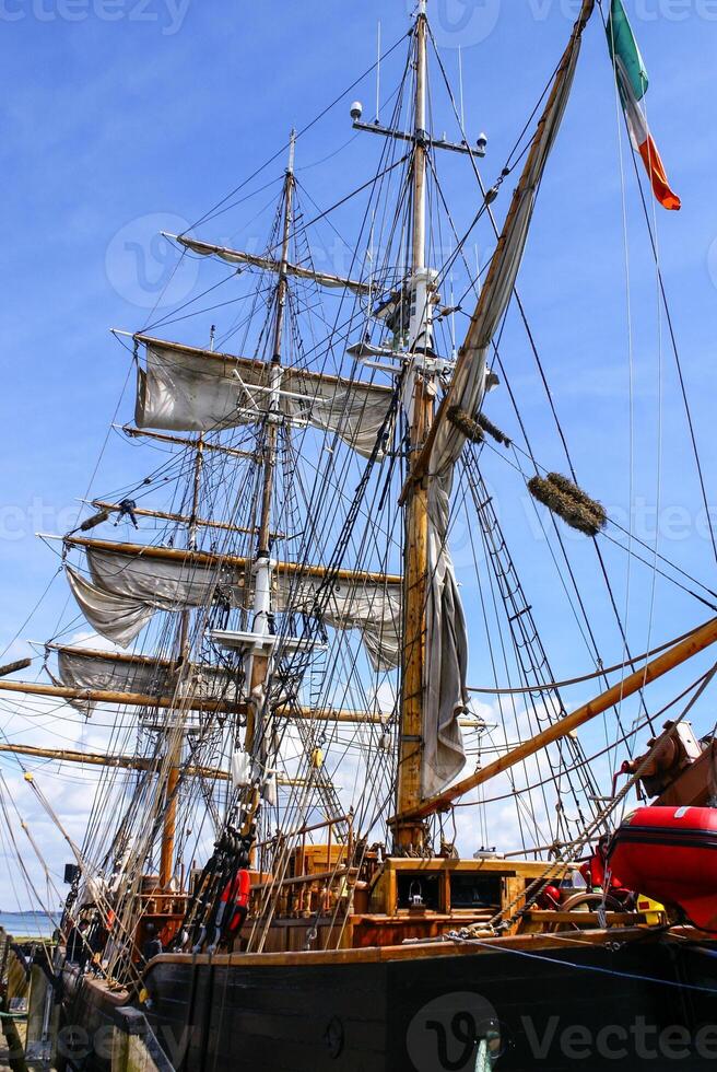 Large mast of an old sailing ship photo