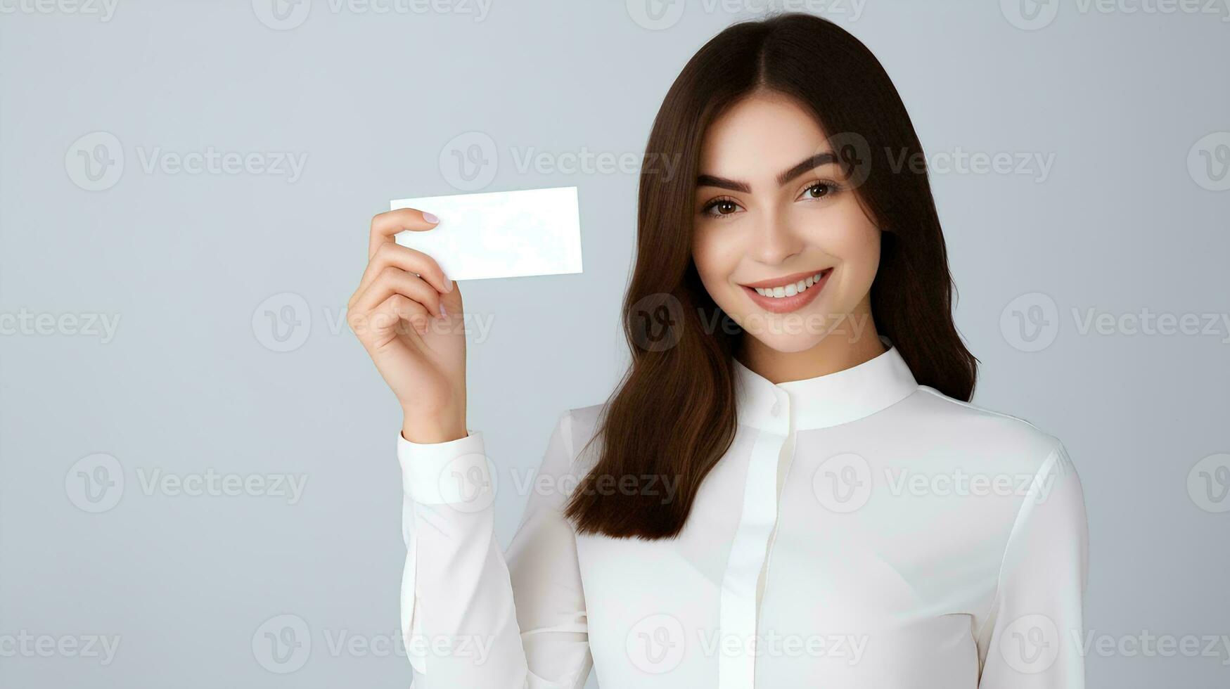 AI generated Cheerful beautiful young businesswoman holding plain business card for mockup material, plain card without text, studio photo, isolated white background photo