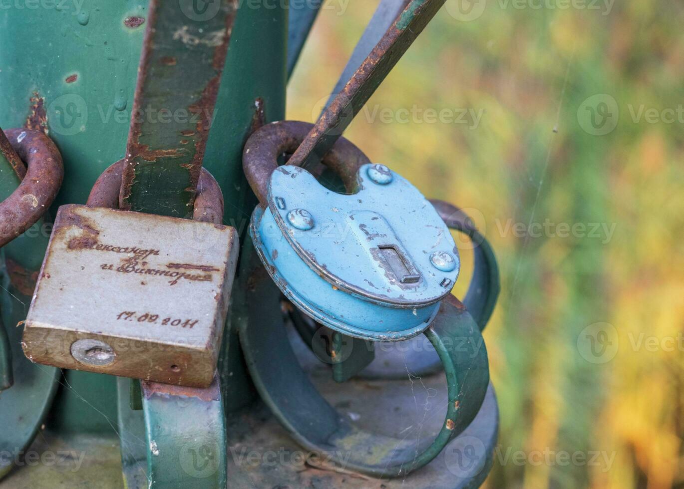 Metal structure where couples locking the locks as a sign of true love. Faith photo