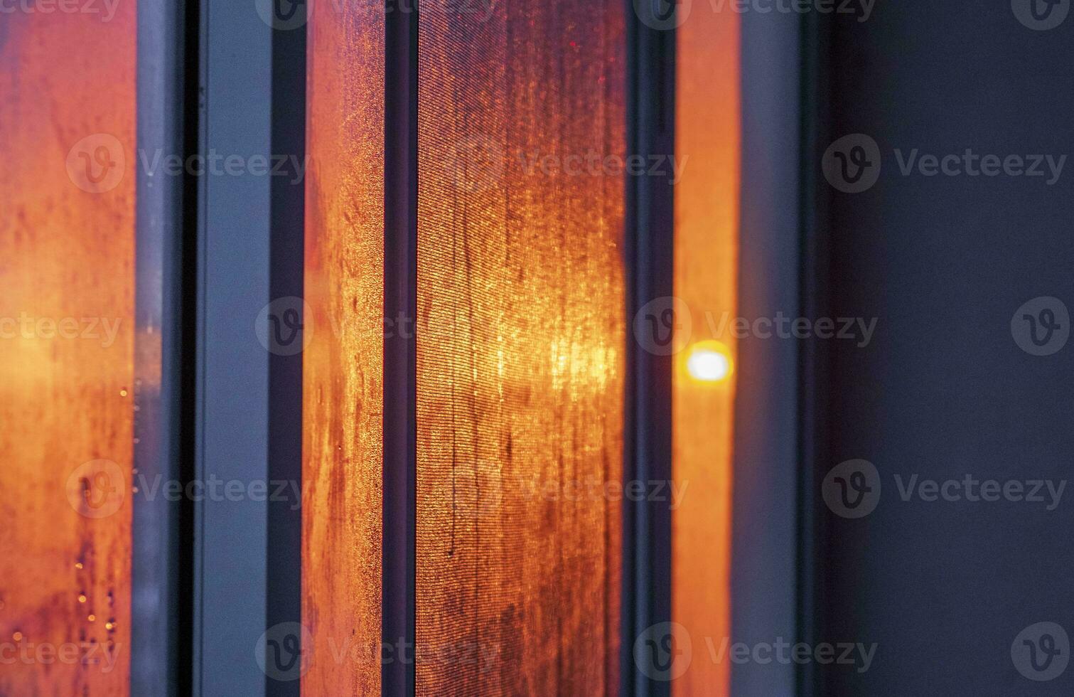 Shot of the sun setting and reflecting in the window. Concept photo