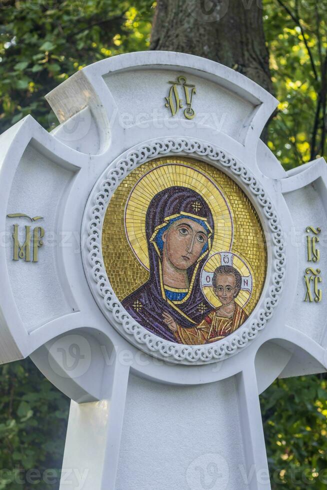 Shot of the stone orthodox cross at cemetery. Religion photo