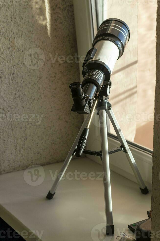 lose up shot of the telescope on the window. Science photo