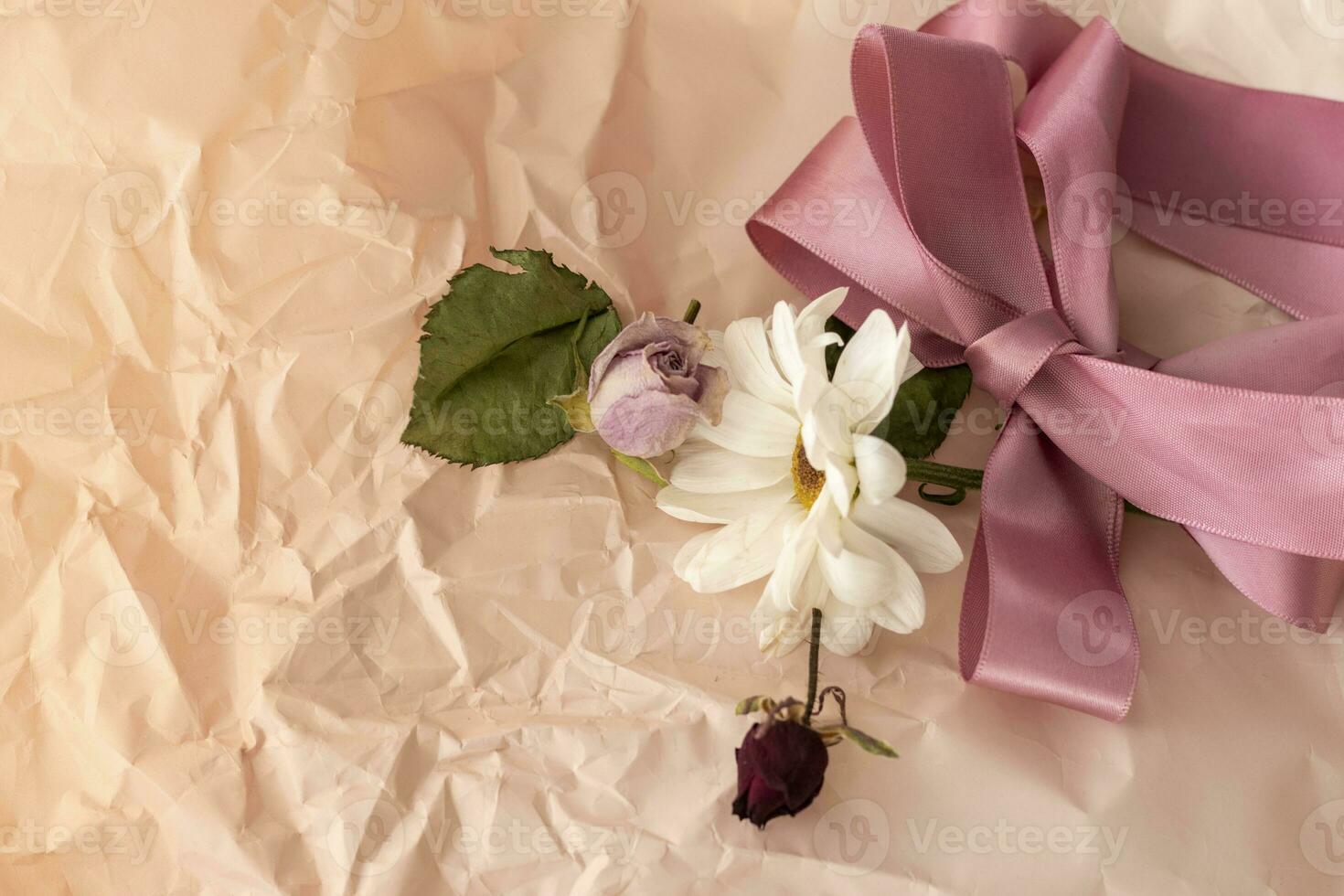 Concept shot of the background theme, wrapping paper, dried roses other flowers and other arrangements. Valentines day photo