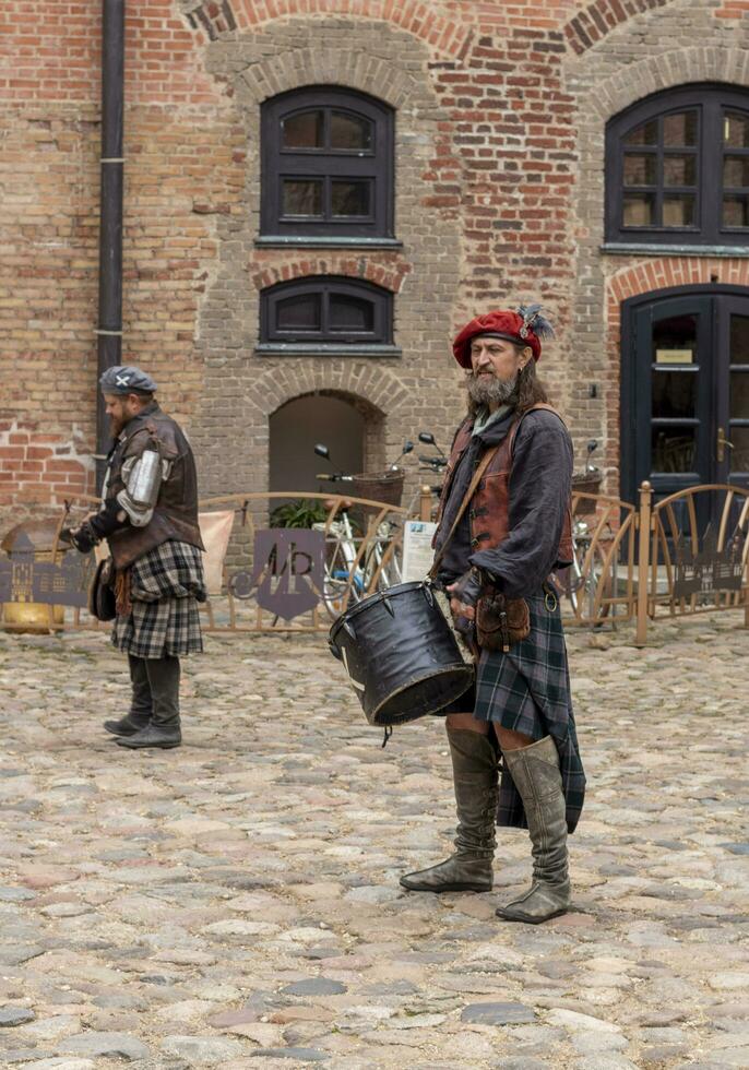 Mir, Belarus - 10.03.2023 -Shot of the the street performers at Mir castle complex. Landmark photo