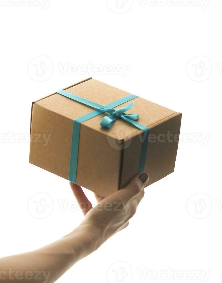 Close up shot of the woman holding rapped gift box. Holiday photo