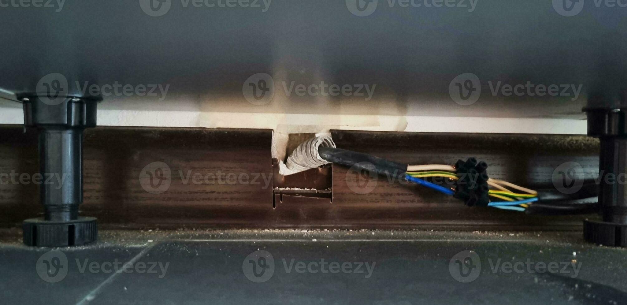 Close up shot of electric connection under the cabinet. Safety photo