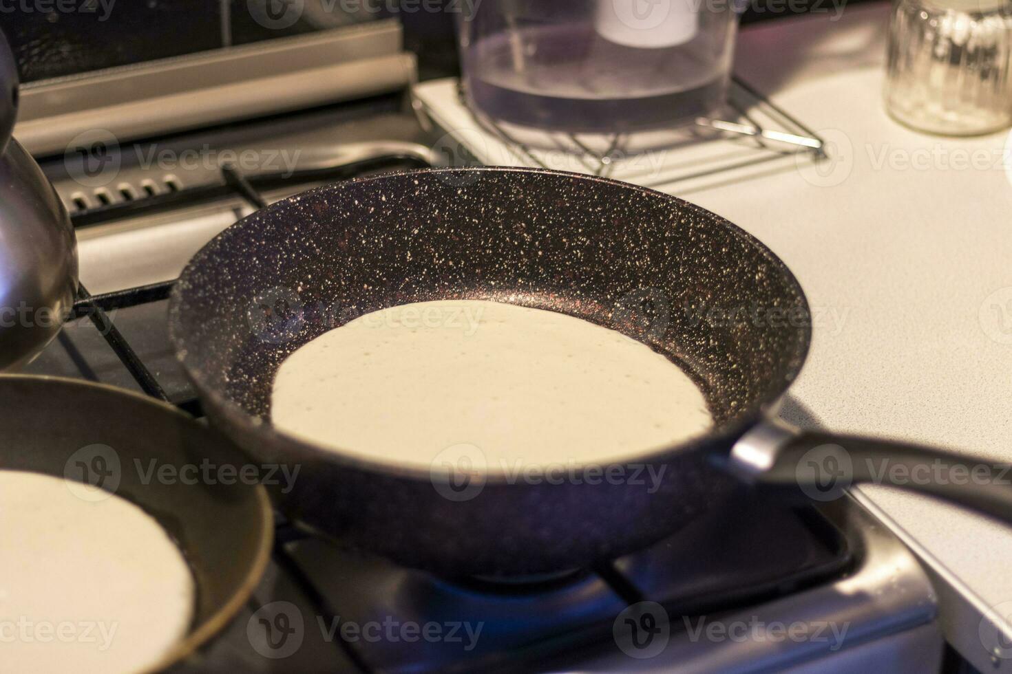 Close up shot of a pancakes being baked on the kitchen. Food photo