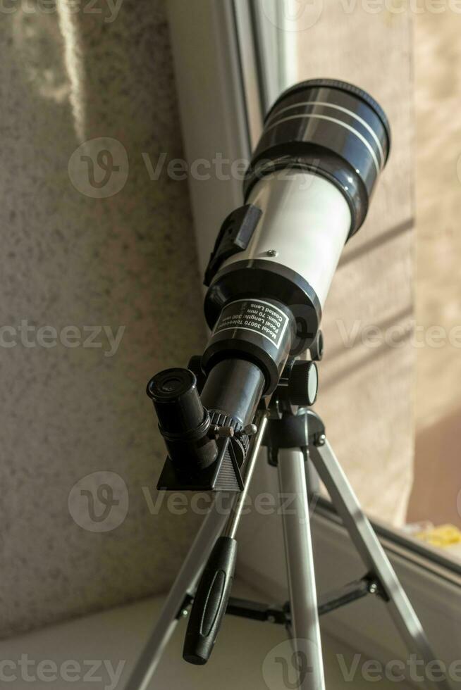 lose up shot of the telescope on the window. Science photo