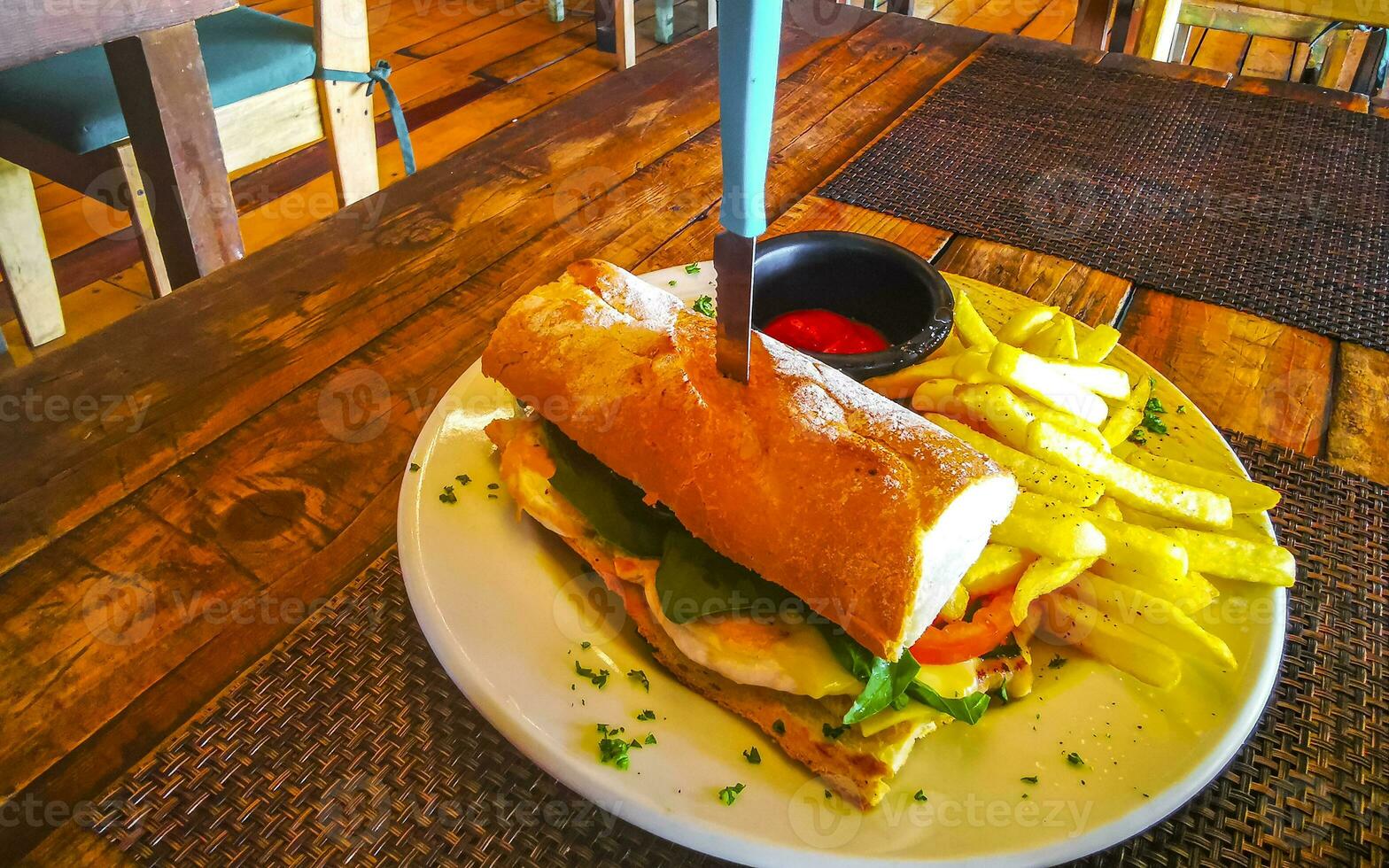 Baguette sandwich toast bread with chicken tomato salad potatoes fries. photo