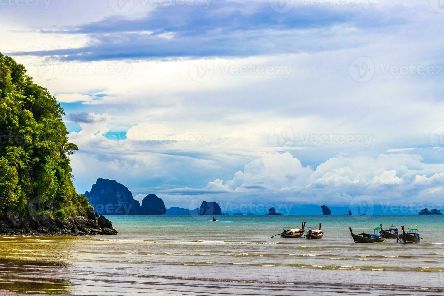 Tropical paradise turquoise water beach longtail boat Krabi Thailand. photo