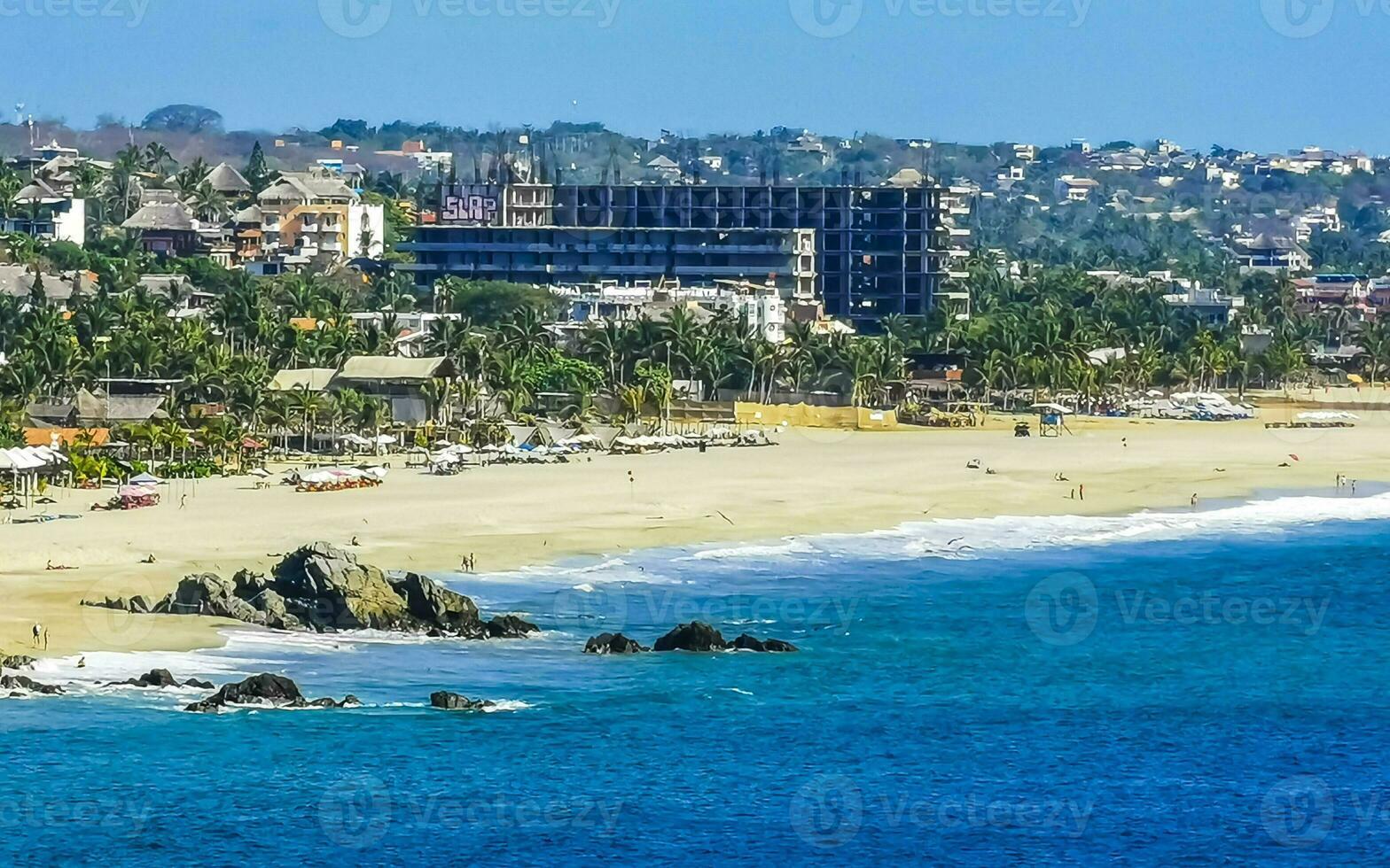 Sun beach sand surfer waves palms in Puerto Escondido Mexico. photo