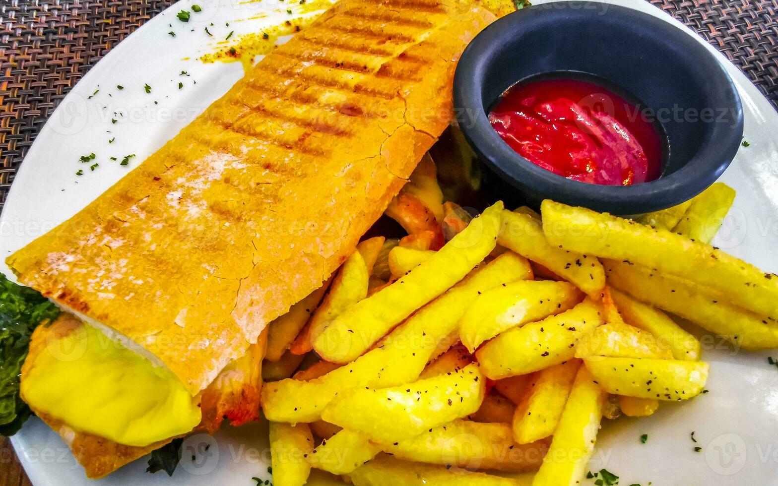 Baguette sandwich toast bread with chicken tomato salad potatoes fries. photo