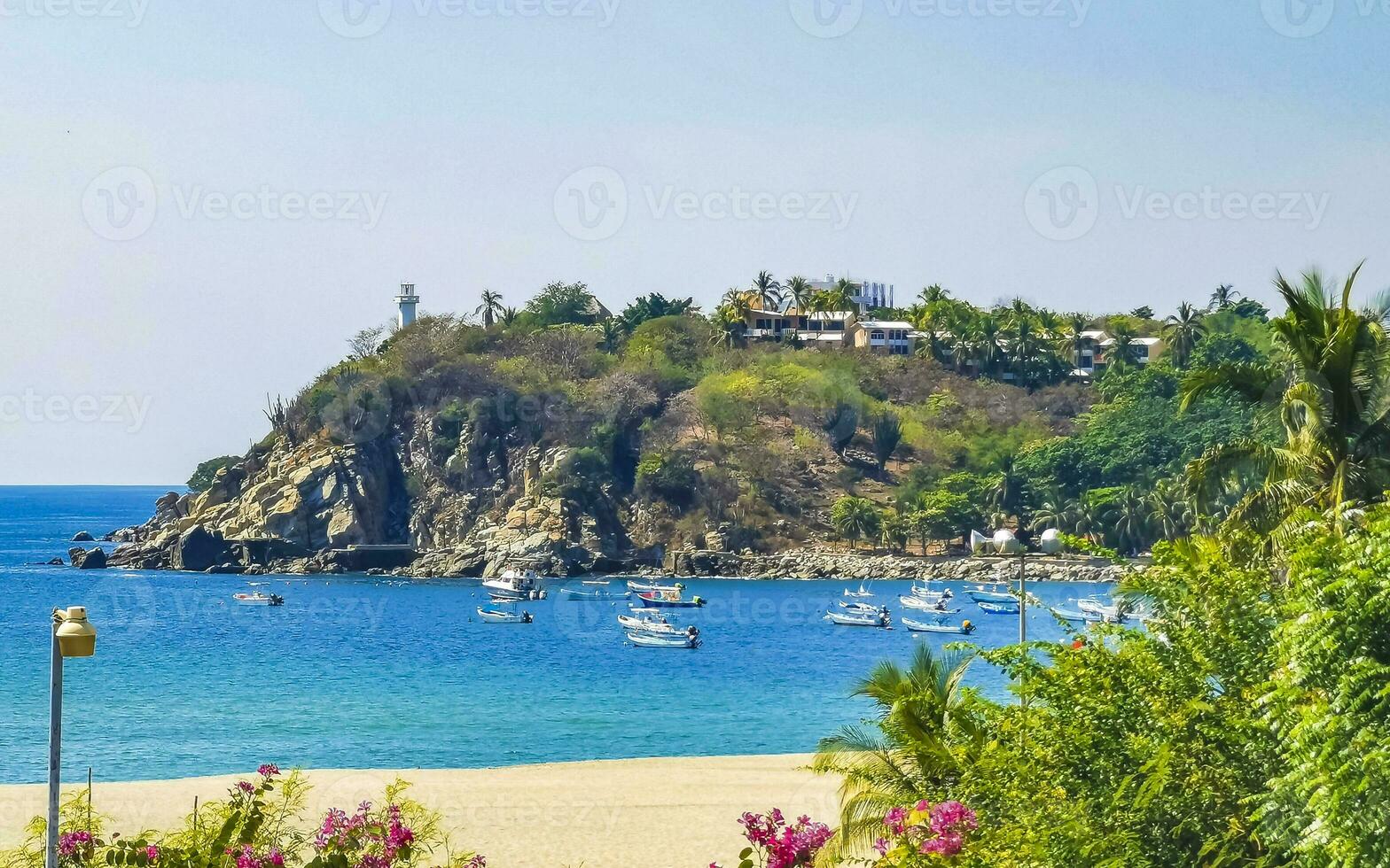 Fishing boats at the harbor beach in Puerto Escondido Mexico. photo