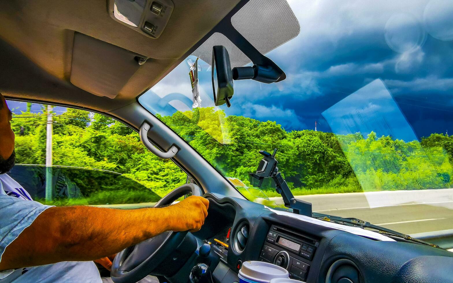 Playa del Carmen Quintana Roo Mexico 2023 Driving on highway in car through tropical storm hurricane Mexico. photo