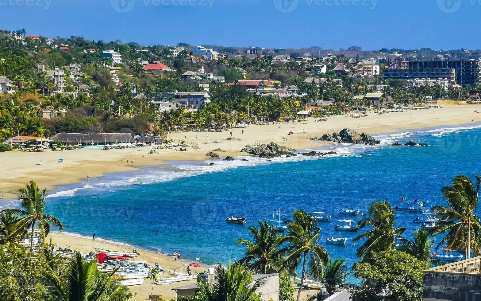 Sun beach sand surfer waves palms in Puerto Escondido Mexico. photo