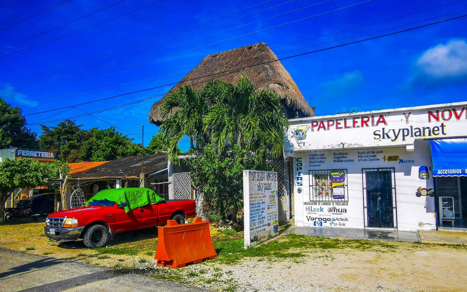 Tulum Quintan Roo Mexico 2023 Typical colorful street road traffic cars palms of Tulum Mexico. photo