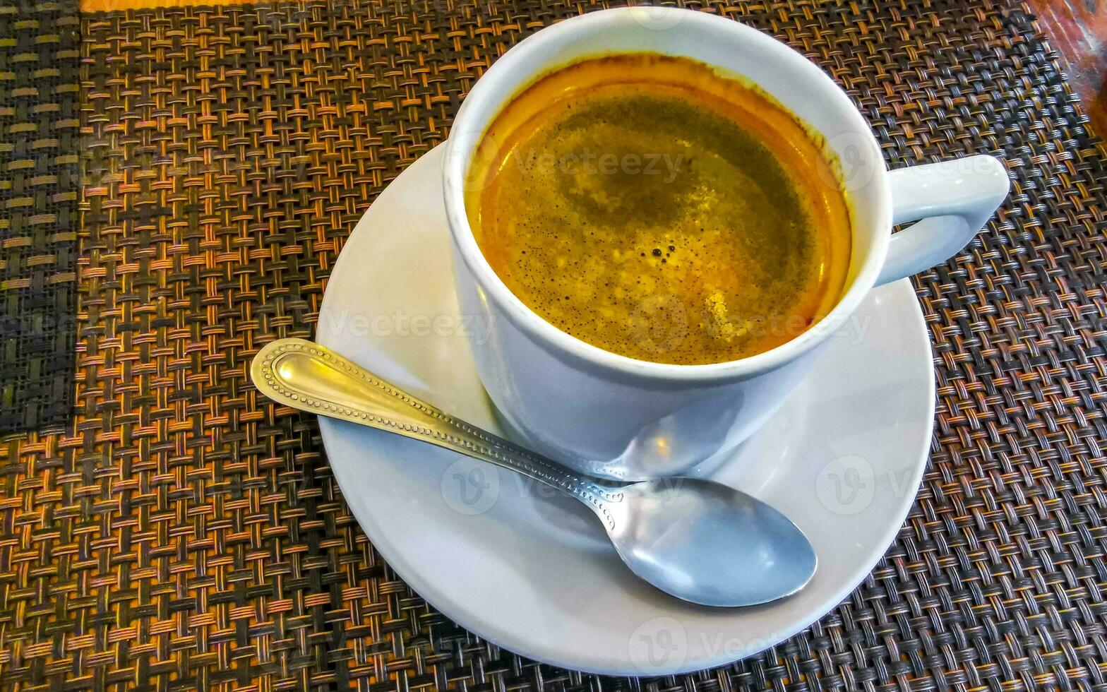 Cup of americano black coffee in restaurant cafe in Mexico. photo