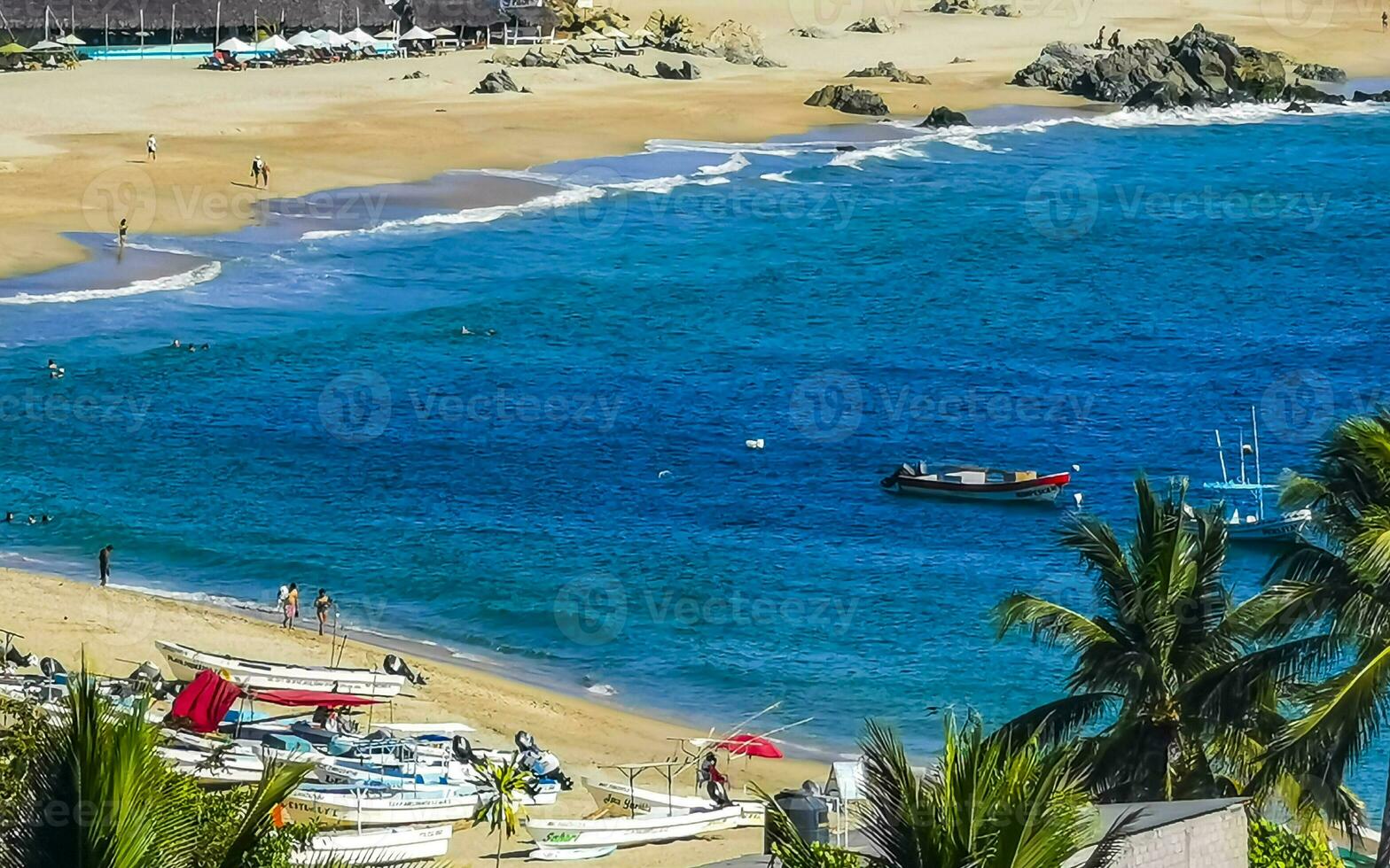 Fishing boats at the harbor beach in Puerto Escondido Mexico. photo