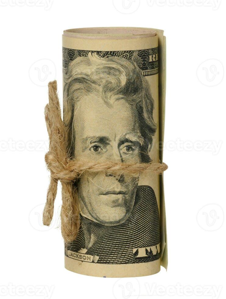 Rolled American dollar twenty dollar bills on isolated background photo