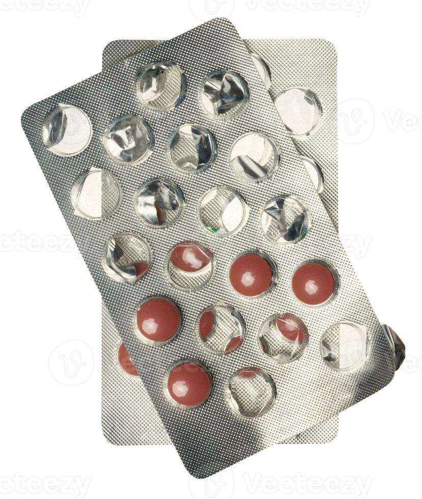 Round brown tablets in blister pack photo