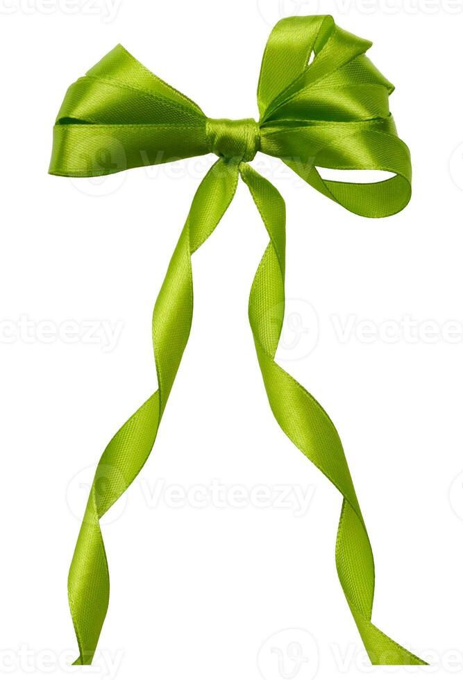 Tied bow from green silk ribbon on isolated background, decor for gift photo