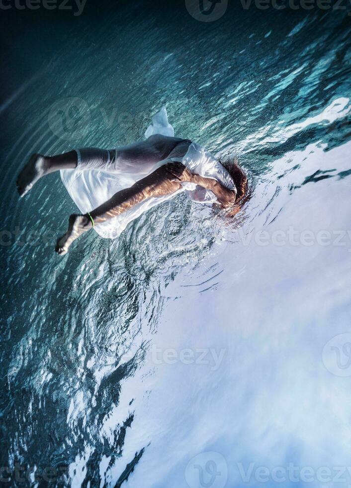 Woman fish out from the sea photo