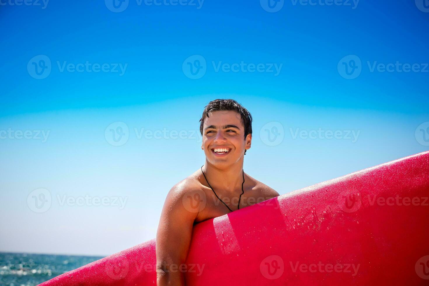 Happy boy enjoying surfing photo