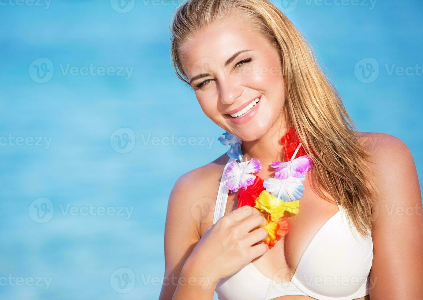 Cute female in Hawaiian leis photo