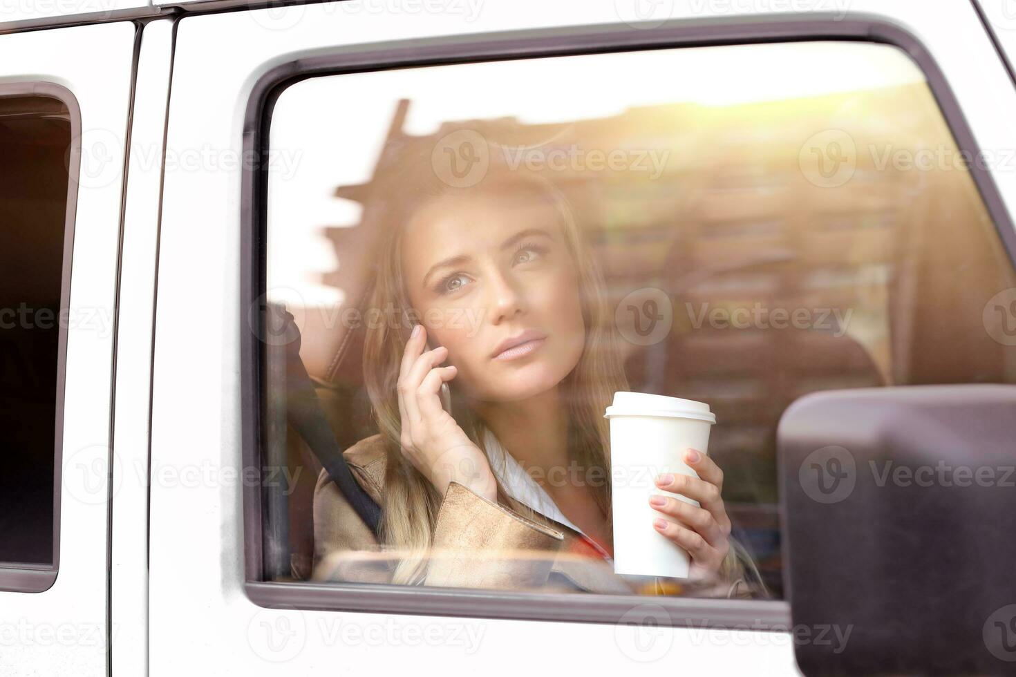 Serious business woman in the car photo