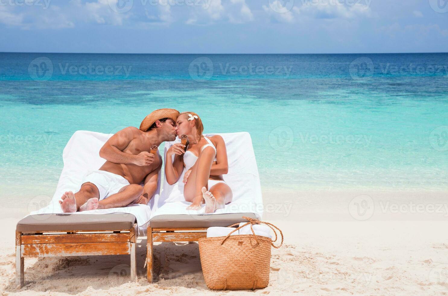 Happy couple on the beach photo