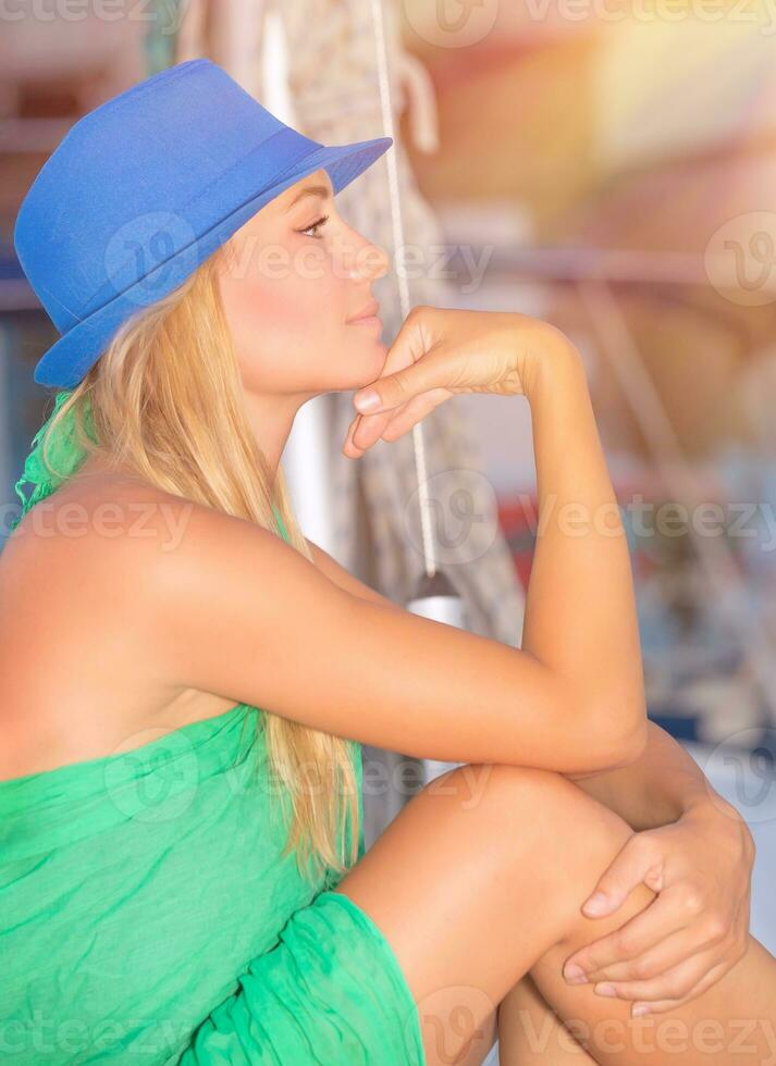 Thoughtful female on sail boat photo