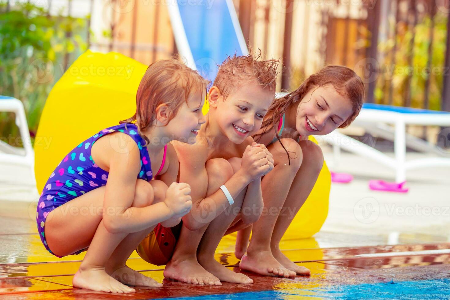 Happy kids near the pool photo