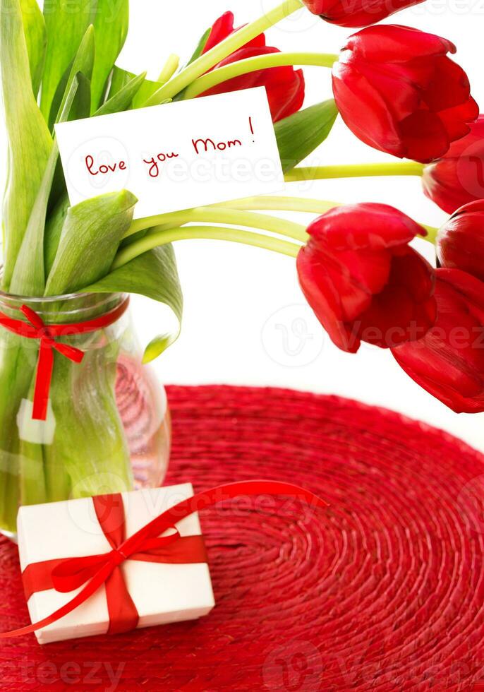 Red tulips with postcard photo