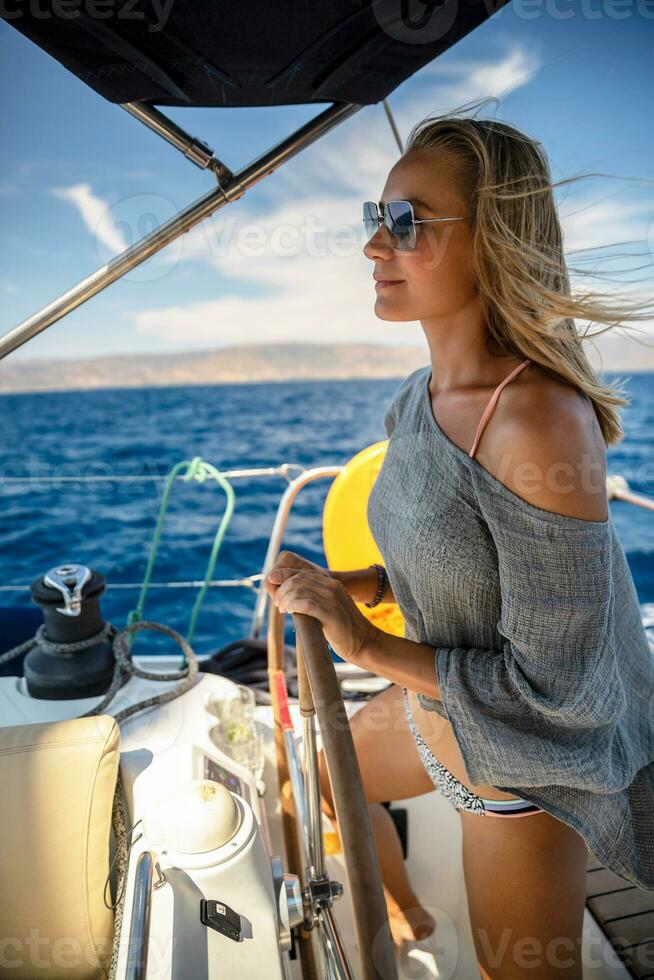 Woman Steering Sailboat photo